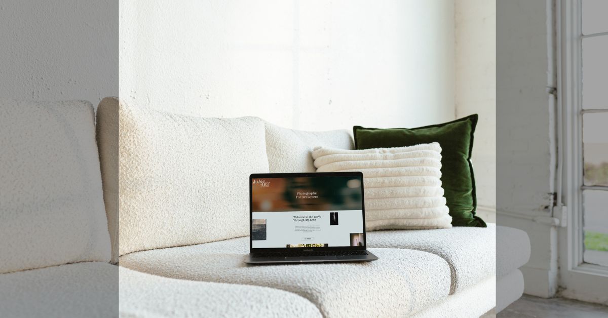 a laptop on a white couch with a Showit website